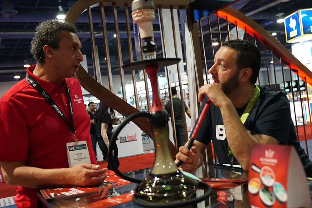 Two people smoking hookah