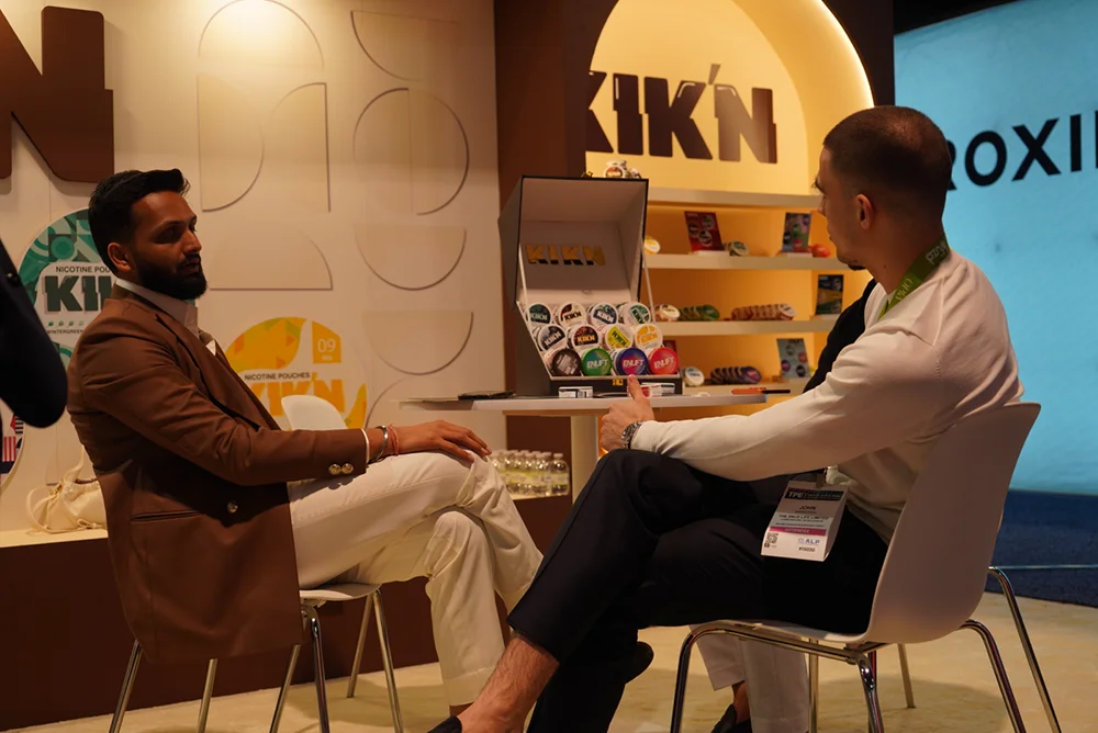 Two people sitting and speaking