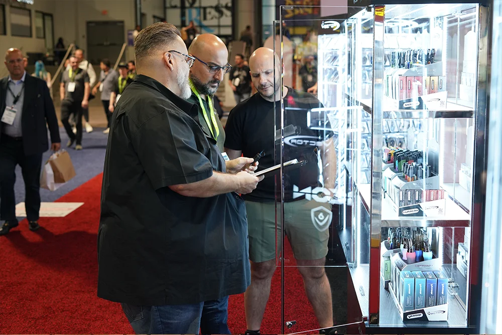 People looking at products behind glass